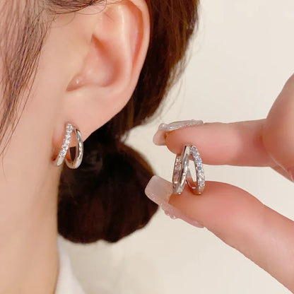 Boucles d’Oreilles Nœud en Acier – Élégance Moderne & Originalité