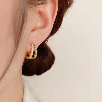 Boucles d’Oreilles Nœud en Acier – Élégance Moderne & Originalité