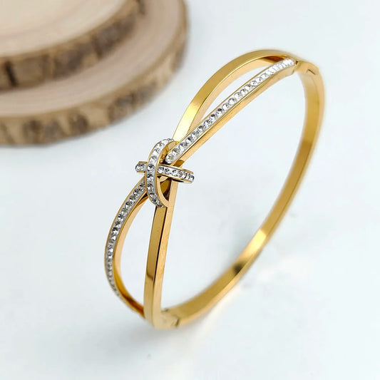 Bracelet élégant en zircon – Acier inoxydable doré ou argenté, design croisé brillant